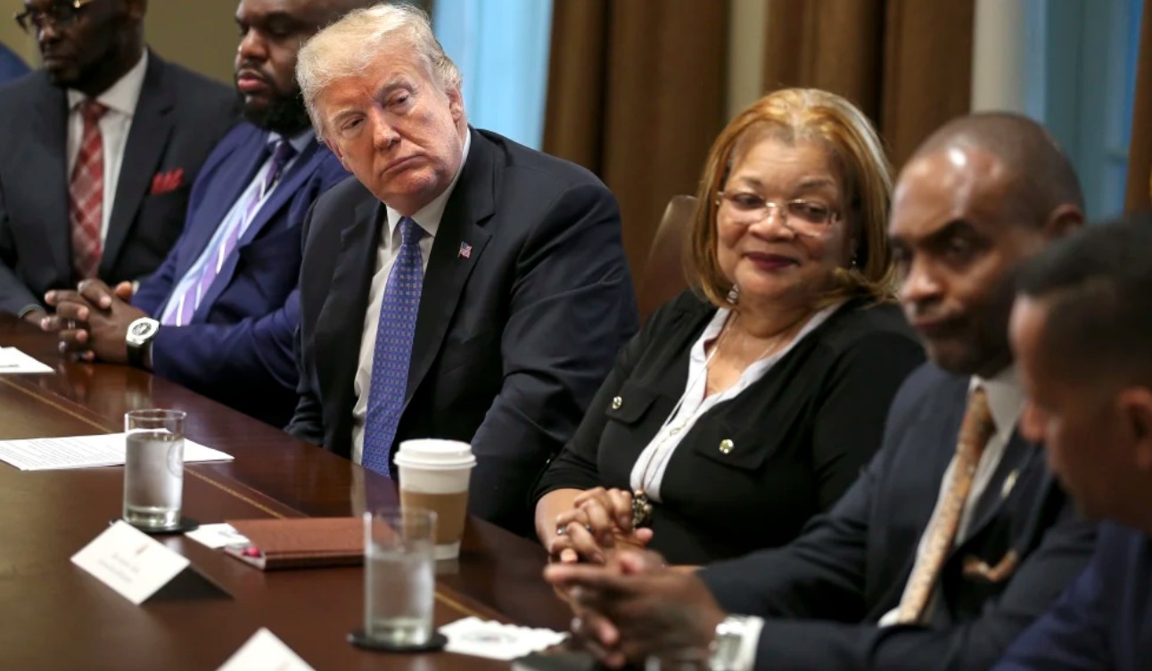 President Donald J. Trump listens during a meeting with inner city pastors in the Cabinet Room of the White House, in Washington