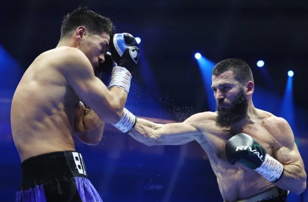 Artur Beterbiev punches Dmitrii Bivol during the IBF, IBO, WBC and WBO World Light Heavyweight titles fight in Riyadh on October 12, 2024 [Richard Pelham/Getty Images]